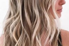 24 honey and shiny icy blonde with a darker root and beach waves are a perfect idea for a summer sunkissed look