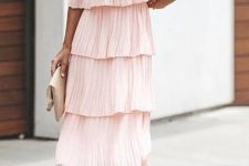 With beige ankle strap sandals and clutch