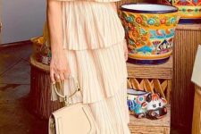 With beige bag and sandals