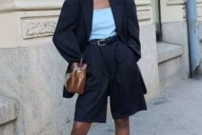 With black oversized blazer, high heels and brown patent leather bag
