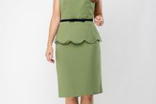 With black patent leather pumps and green knee-length skirt