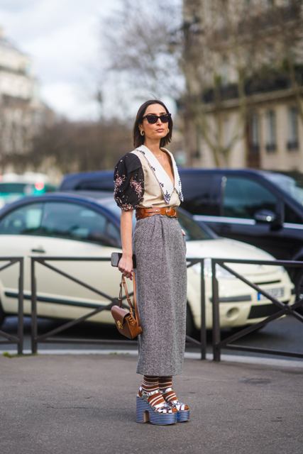 With gray midi skirt, printed blazer, brown belt and brown bag