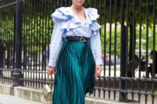 With light blue ruffled blouse and two colored low heeled shoes