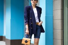 With navy blue blazer, yellow bag, white shoes and white shirt