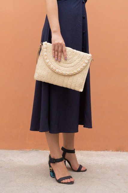 With navy blue midi dress and sandals with printed heels