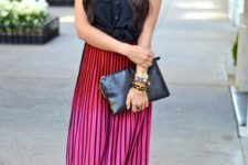 With ombre maxi skirt and black clutch