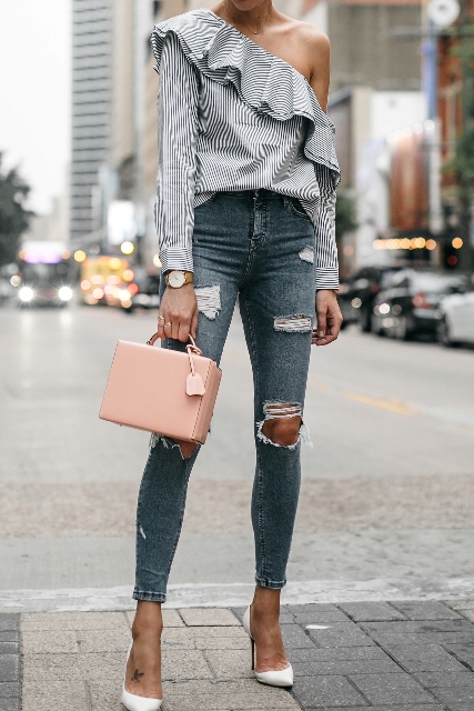 With pale pink box bag, white pumps and distressed jeans