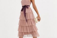 With purple belt, beige clutch and pale pink lace up high heels