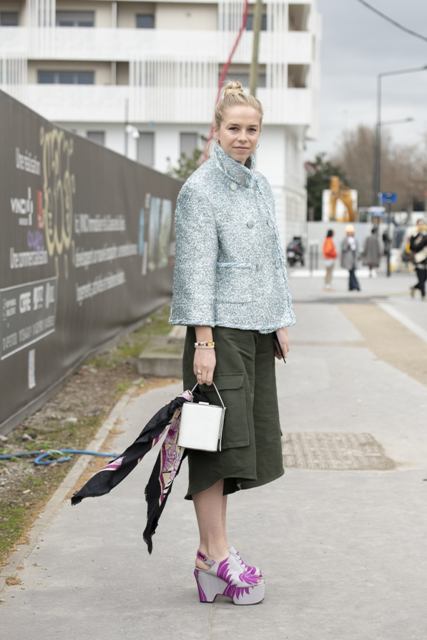 With silver jacket, white mini bag and olive green culottes