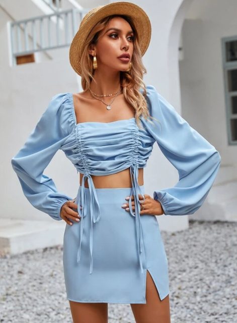 With straw hat and light blue mini skirt