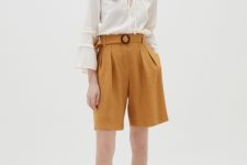 With white bell sleeve blouse and brown flat sandals
