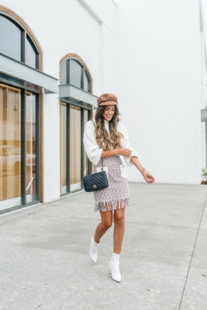 With white blouse, beige cap, chain strap bag and white ankle boots