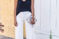 With white culottes, gray bag and black ankle strap shoes