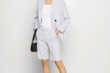 With white top, lilac blazer, black leather bag and silver low heeled mules