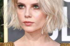 a beautiful short blonde bob with much volume and slight waves is a very chic and stylish idea