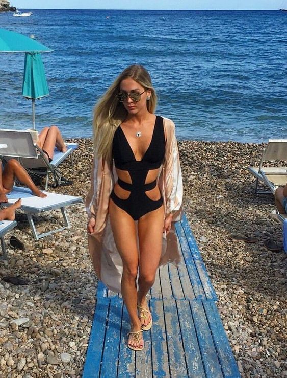 a black one piece swimsuit with a deep neckline, side cutouts is a sexy and cool idea to rock