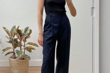a black sleeveless top, navy trousers, black birkenstocks are great for a very laconic and bold summer work look