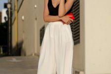 a black top, white linen culottes, whimsy heels and a red clutch plus sunglasses for a hot summer day
