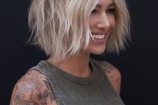 a blonde shaggy short bob with a darker root is a creative and fresh idea to stand out from the crowd
