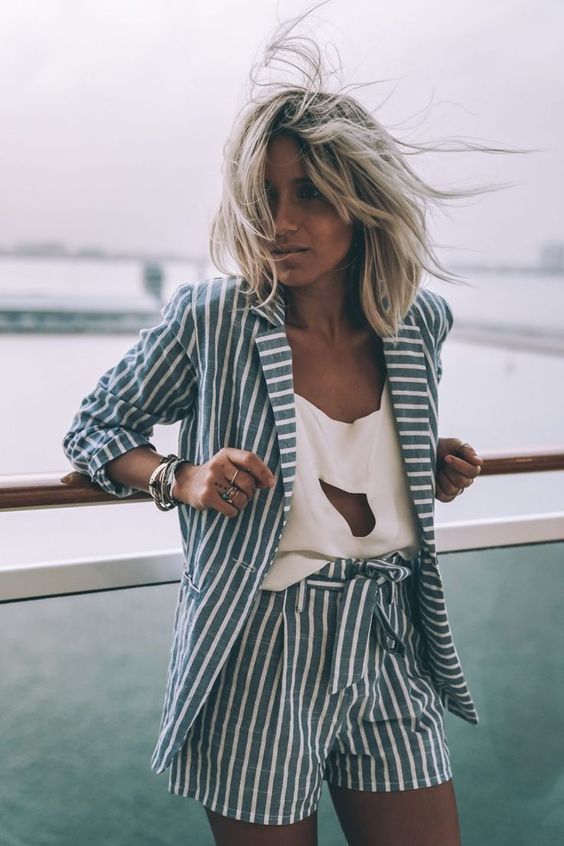 a blue and white striped short linen suit plus an eye catchy white cutout top for a bold summer look