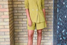 a bright green linen suit with an oversized blazer and shorts, lace up shoes for a trendy professional look