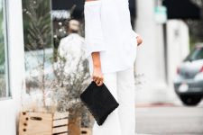 a chic outfit with a white off the shoulder top, white jeans, catchy heels and a black bag