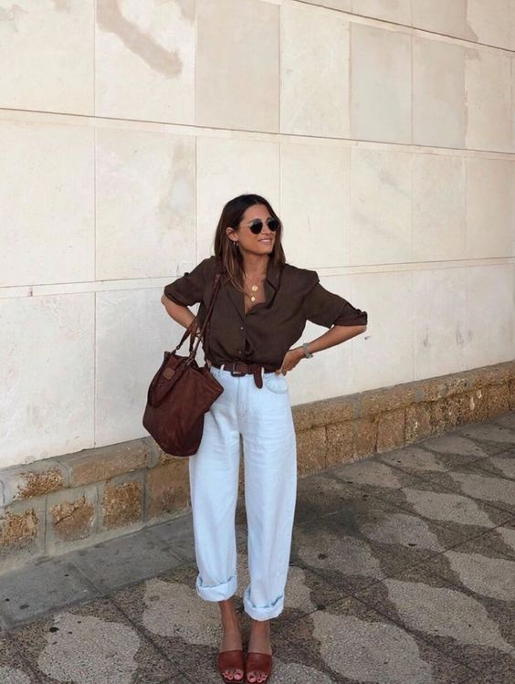 a chocolate brown shirt with cuffed sleeves, white linen pants, a brown belt and shoes, a brown tote for a hot summer day