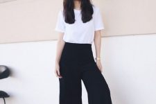 a minimalist look with a white t-shirt, black culottes and nude wide strap platform shoes for a hot summer day