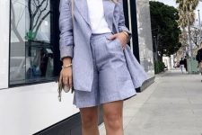 a perfect summer wokr look with a white tee, a lilac linen short suit with Bermudas, white strappy heels and a bag