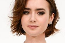 a short brunette bob with slight waves and side parting, with a touch of ladder is elegant and timeless