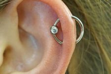 a simple and cool helix orbital piercing with a hoop earring with a rhinestone is a lovely idea to rock