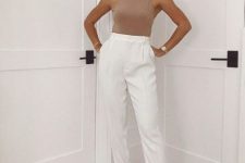 a simple and very trendy look with a nude halter neckline top, white high waisted trousers, nude heeled flipflops and a statement necklace