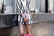 a striped linen suit with a white t-shirt, a red bag and silver shoes plus a red lipstick for summer