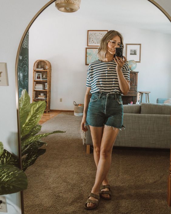 a striped tee, blue denim shorts with fringe and grey birkenstocks for a lovely summer look