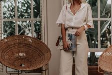 a stylish and relaxed work look with a white linen shirt, neutral linen pants, heels and a bag for a hot summer day