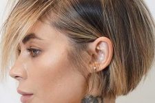 a stylish straight short bob with blonde balayage including face framing highlights looks bold and stylish