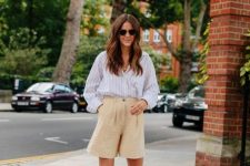 a summer outfit with a striped shirt, tan linen shorts, black Birkenstocks for a realxed feel
