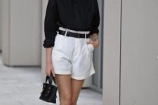 a super chic work look with a black linen shirt and white shorts, a black belt, lace up sandals and a bag