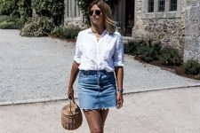 a white linen shirt, a blue denim mini, black slingbacks and a round basket bag for a girlish vacation look