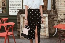 a white t-shirt, a black polka dot button up midi skirt, black espadrilles and a two tone bag for a cool girlish look