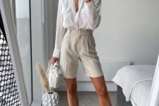a work look with a white shirt, creamy linen Bermudas, white square toe heels and a white clutch