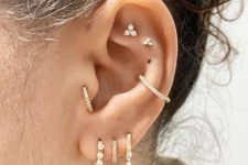 03 bold styling with a double flat, a conch, a triple lobe and a tragus piercing is a very cool and fresh idea to rock