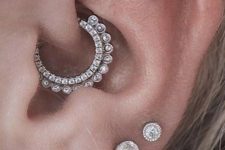 09 glam ear styling with a multiple lobe, a double flat and a daith piercing, with gorgeous shiny studs and rhinestone hoops