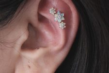 13 a gorgeous triple flat piercing done with matching opal studs of different sizes is a cool idea with a girlish feel