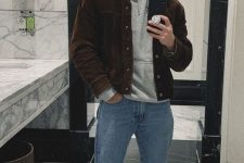 21 a grey hoodie, blue jeans, white sneakers, a brown corduroy jacket and a grey beanie for a comfy look