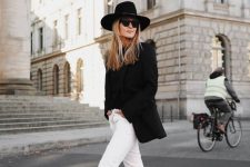 29 a monochromatic fall outfit wiht a black tee, a black blazer, white jeans, black ankle booties and a hat