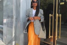 37 a stylish look with a white tee, a yellow slip midi, a grey plaid blazer, white trainers and a grey tote is chic