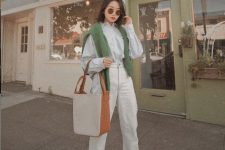 40 a fall outfit with a white shirt, white jeans, orange booties, a greye jumper and a two tone bag