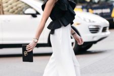 With black clutch, white culottes and beige high heels