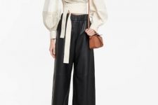 With black leather palazzo pants, brown bag and black and brown flat mules